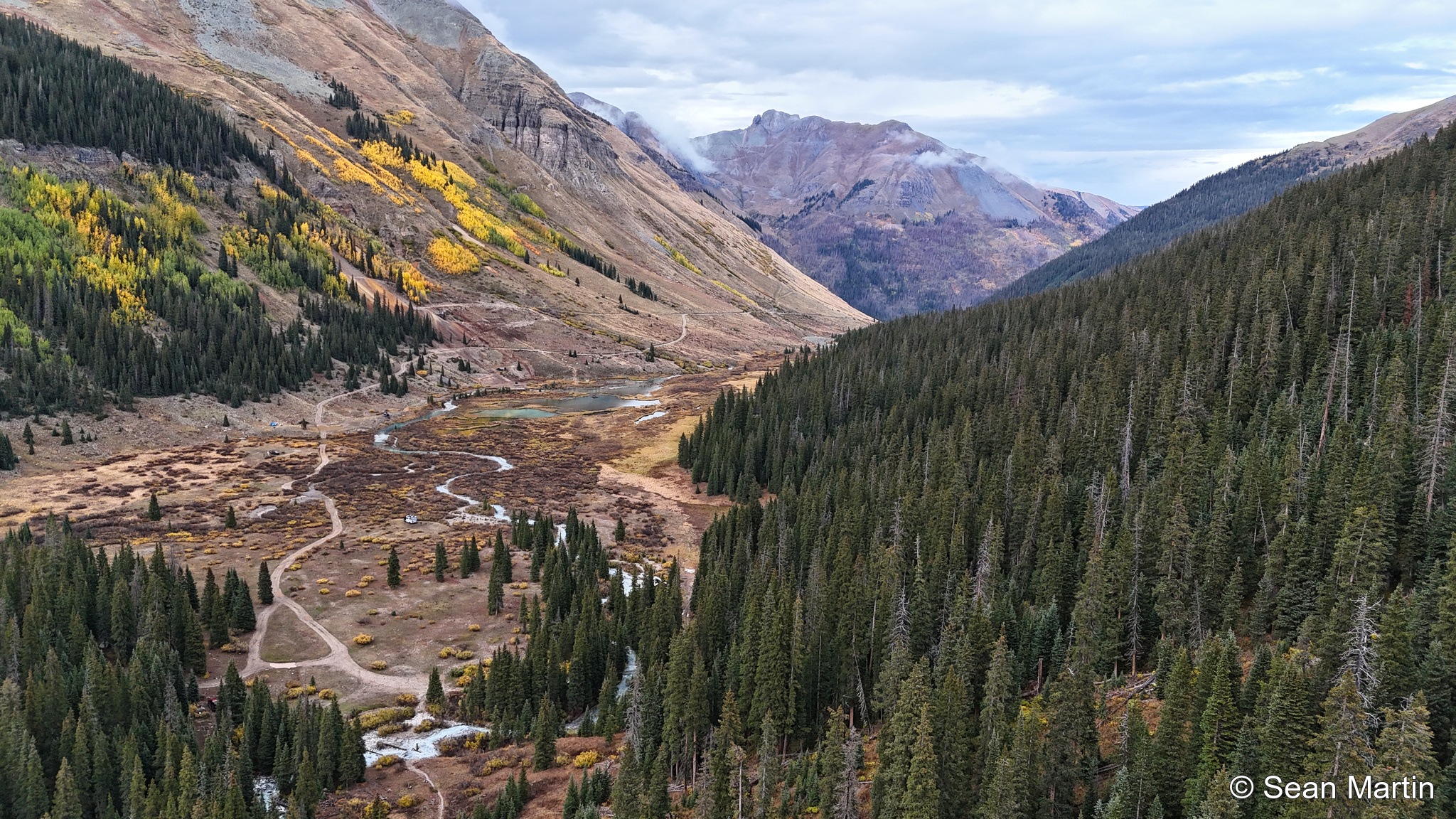 Wide view of the creek valley and autumn slopes near Silverton